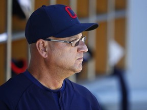 FILE - In this March 24, 2017, file photo, Cleveland Indians manager Terry Francona pauses in the dugout prior to the team's spring training baseball game against the Chicago Cubs in Mesa, Ariz. Francona remained hospitalized Thursday, July 6, with no clear timetable for his return. Francona spent his third straight day at the Cleveland Clinic, where he has been undergoing tests -- and possibly a procedure -- to resolve the causes of him becoming light-headed over the past month. The 58-year-old was hospitalized twice last month and doctors admitted him Tuesday, about one week after he began wearing a heart monitor. (AP Photo/Ross D. Franklin, File)