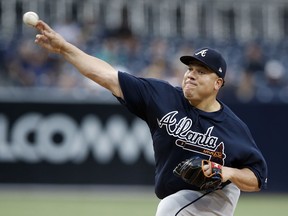FILE - In this June 28, 2017, file photo, Atlanta Braves starting pitcher Bartolo Colon throws during the first inning of the team's baseball game against the San Diego Padres in San Diego. Colon has agreed to terms on a minor league deal with the Minnesota Twins. The 44-year-old with 235 career victories was designated for assignment last Thursday by the Braves, a day after a loss to San Diego dropped his record to 2-8. He had an 8.14 ERA in 13 starts. The Twins say Colon will report to Triple-A Rochester soon. The announcement was made in the third inning of Minnesota's game Friday against Baltimore. (AP Photo/Alex Gallardo, File)