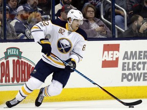 FILE - In this March 28, 2017, file photo, Buffalo Sabres forward Marcus Foligno carries the puck against the Columbus Blue Jackets during an NHL hockey game in Columbus, Ohio. Marcus Foligno has left the leap behind in Buffalo. That doesn't mean his offensive production can't or won't continue to rise in Minnesota. Coming off a career-high 13 goals for the Sabres last season, the soon-to-be-26-year-old was acquired in a trade earlier this summer to bring some needed grit and strength to the left wing position. (AP Photo/Paul Vernon, File)