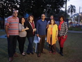 In this Sunday, May 28, 2017 photo, former members of the Rhema Community Evangelical Ministry, from left, Marcelo Galvao Machado, Tania Machado, Naara Abe, Flavio Correa de Souza, Carlos, Rosangela Ferreira Souza, and Maria Reis, stand in a park in Franco da Rocha, Brazil, in the greater Sao Paulo area. Over the course of two decades, the U.S.-based Word of Faith Fellowship mother church took command of theirs and another congregation in Brazil, applying a strict interpretation of the Bible and enforcing it through rigorous controls and physical punishment, The Associated Press has found. (AP Photo/Andre Penner)