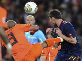 The retired English referee showed De Jong a yellow card in the 28th minute for his karate kick into the chest of Alonso. (AP Photo/Daniel Ochoa de Olza, File)