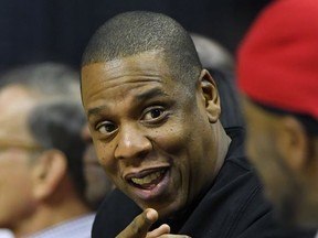FILE - In this Dec. 7, 2016, file photo, rapper Jay-Z appears at a NBA basketball game between the Los Angeles Clippers and the Golden State Warriors in Los Angeles. The rap icon announced the "4:44" tour on Monday, July 10, 2017, which kicks off Oct. 27, 2017, at the Honda Center in Anaheim, Calif. It wraps Dec. 21, 2017, at the Forum in Inglewood, Calif.  (AP Photo/Mark J. Terrill, File)
