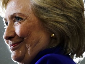 FILE - In this Sept. 21, 2016, file photo, Democratic presidential candidate Hillary Clinton pauses as she speak during a campaign stop at the Frontline Outreach Center in Orlando, Fla. Clinton is calling her new book "What Happened" and promising to let her "guard down" as she remembers her defeat last year to Donald Trump. Simon & Schuster told The Associated Press on Thursday, July 27, 2017, that Clinton will describe the "intense personal experience" of being the first woman nominated by a major party for president. (AP Photo/Matt Rourke, File)