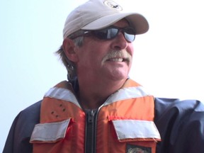 This 2015 photo frame from video provided by the International Fund for Animal Welfare shows Joe Howlett off the coast of Campobello Island in Canada. Howlett was killed Monday, July 10, 2017, after freeing a North Atlantic right whale that had been entangled in fishing gear off New Brunswick. (IFAW via AP)