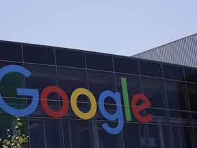 FILE - This Tuesday, July 19, 2016, file photo shows the Google logo at the company's headquarters in Mountain View, Calif. Google parent Alphabet is taking a $2.7 billion write-down to cover a large fine EU antitrust enforcers assessed in June 2017. While the search giant can shrug off the cost, uncertainty lingers over its ability to operate freely on the continent going forward. (AP Photo/Marcio Jose Sanchez, File)