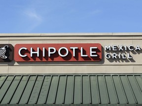 FILE - This Monday, Feb. 8, 2016, file photo shows the sign over a Chipotle Mexican Grill restaurant. On Wednesday, July 26, 2017, Chipotle said it received a follow-up subpoena on July 19, for information tied to what health officials believe was a norovirus outbreak at a restaurant in Sterling, Va., earlier in the month. In 2016, the company said that federal officials subpoenaed information tied to a California store hit with a norovirus outbreak in 2015. The investigation is being conducted by the U.S. District Attorney's Office for the Central District of California and the FDA. (AP Photo/Chris O'Meara, File)