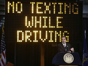 FILE - In this May 31, 2013 file photo, New York Gov. Andrew Cuomo speaks during a news conference to announce the increase in penalties for texting while driving in New York. New York state is set to study the use of a device known as the "textalyzer" that would allow police to determine whether a motorist involved in a serious crash was texting while driving. Cuomo announced Wednesday, July 26, 2017, that he would direct the Governor's Traffic Safety Committee to examine the technology, as well as the privacy and constitutional questions it could raise. (AP Photo/Frank Franklin II, File)