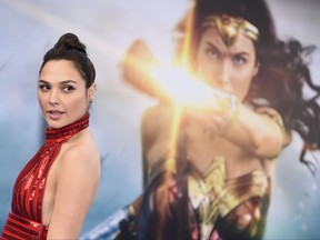 FILE - In this May 25, 2017 file photo, Gal Gadot arrives at the world premiere of "Wonder Woman" in Los Angeles. Wonder Woman 2" is set to storm theaters on December 13, 2019. Warner Bros. announced the date late Tuesday, July 25. "Wonder Woman" star Gadot is set to reprise her role as Diana of Themyscira, but a director has yet to be set. Patty Jenkins is still in negotiations for the job. (Photo by Jordan Strauss/Invision/AP, File)