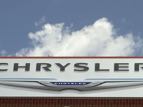 FILE - In this July 22, 2011 file photo, the Chrysler logo is displayed at a car dealership in Omaha, Neb. U.S. regulators have blessed emissions controls on 2017 versions of Fiat Chrysler diesel trucks, allowing them to go on sale and potentially helping to resolve allegations that the company cheated on pollution tests. The Environmental Protection Agency on Friday, July 28, 2017  certified diesel Ram pickups and Jeep Grand Cherokee SUVs as compliant with the Clean Air Act. The move could help to end a government lawsuit alleging the company installed illegal pollution control software on 104,000 of its 2014 through 2016 3-liter diesels.(AP Photo/Nati Harnik)