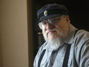 FILE - In this March 12, 2012 file photo, George R.R. Martin, author of the popular book series "A Song of Ice and Fire," which inspired the hit HBO series "Game of Thrones" poses in Toronto. Martin says the next "Song of Ice and Fire" book has a real chance of coming out in 2018. In a weekend posting on his web site, Martin wrote that he is working hard on "The Winds of Winter," the long-awaited sixth volume in the series. He added that he has "good days and bad days" and is still months away from finishing.    (AP Photo/The Canadian Press, Nathan Denette, File)