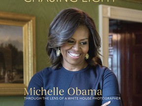 This cover image released by Ten Speed Press shows, "Chasing Light: Michelle Obama Through the Lens of a White House Photographer," by Amanda Lucidon. Ten Speed Press told The Associated Press on Tuesday, July 11, 2017, that the collection of White House pictures of Michelle Obama is coming out Oct. 17. (Amanda Lucidon/Ten Speed Press via AP)