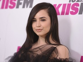 FILE - In this May 13, 2017 file photo, actress Sofia Carson from "Descendants" arrives at Wango Tango in Carson, Calif. Carson and tennis star Novak Djokovic will be among the headliners at this year's Arthur Ashe Kids' Day, a stadium show on Saturday, Aug. 26, that kicks off the 2017 U.S. Open. (Photo by Richard Shotwell/Invision/AP, File)
