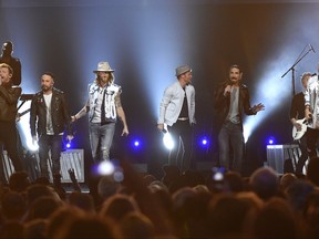 FILE - In this April 2, 2017 file photo, Tyler Hubbard, from right, and Brian Kelley, third from left, of Florida Georgia Line, and from left, Nick Carter, AJ McLean, Brian Littrell, and Kevin Richardson, of Backstreet Boys, perform at the 52nd annual Academy of Country Music Awards in Las Vegas. Backstreet Boys got their first hit country song this year on a collaboration with country duo Florida Georgia Line and now the two powerhouse acts are teaming up for a "CMT Crossroads" episode airing Aug. 30. (Photo by Chris Pizzello/Invision/AP, File)