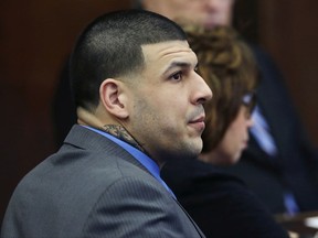 FILE - In this April 11, 2017, file photo, defendant Aaron Hernandez listens as Judge Jeffrey Locke addresses the jury's question during his double murder trial at Suffolk Superior Court in Boston. A wrongful death lawsuit filed against the estate of former NFL star Aaron Hernandez is headed back to court. A status hearing is scheduled for Tuesday, July 11, in Suffolk County Superior Court. (AP Photo/Elise Amendola, Pool, File)