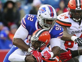 In this Dec. 18, 2016, photo, Buffalo Bills defensive end Adolphus Washington (92) sacks Cleveland Browns quarterback Robert Griffin III (10) during the second half of an NFL football game in Orchard Park, N.Y. Washington has been arrested in Ohio on a weapons charge. He was processed at the Sharonville Police Department and released. The Bills released a statement Monday night, July 10, 2017, saying they're aware of the situation and have been in contact with Washington. (AP Photo/Bill Wippert)