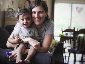In this July 26, 2016, photo taken by Zoe Chandra, Alison Chandra and her son, Ethan, 3, both of Middlesex, N.J., pose for a photo in Middlesex. Ethan suffers from heterotaxy syndrome, a rare genetic disorder that causes organs to form incorrectly or in the wrong place. Their story drew attention in June 2017 when Chandra shared a photo of a hospital bill for Ethan's latest heart surgery. The charges added up to more than $230,000 but Chandra owed only $500 after insurance. (Zoe Chandra via AP)