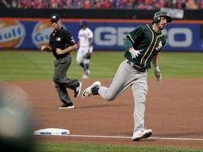 Oakland Athletics' Matt Joyce rounds third base after hitting a solo home run against the New York Mets during the first inning of a baseball game, Saturday, July 22, 2017, in New York. (AP Photo/Julie Jacobson)