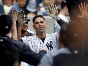New York Yankees' Gary Sanchez is congratulated by teammates after hitting a solo home run against the Tampa Bay Rays during the fourth inning of a baseball game, Saturday, July 29, 2017, in New York. (AP Photo/Julie Jacobson)