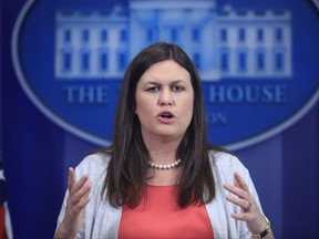 FILE- In this June 30, 2017, file photo, White House deputy press secretary Sarah Huckabee Sanders speaks during the daily press briefing at the White House in Washington. The White House indicated Sunday, July 23, that President Donald Trump would sign a sweeping Russia sanctions measure that requires him to get Congress' permission before lifting or easing the economic penalties against Moscow. Sanders, the newly appointed White House press secretary, said the administration is supportive of being tough on Russia and "particularly putting these sanctions in place." (AP Photo/Manuel Balce Ceneta, File)