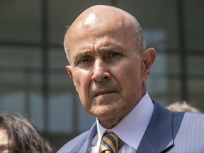 FILE - In this May 12, 2017, file photo, former Los Angeles County Sheriff Lee Baca leaves federal court in Los Angeles after he was sentenced to three years in prison for obstructing an FBI investigation into abuses at the jails he ran. Baca's attorneys filed the request with the 9th U.S. Circuit Court of Appeals Monday, July 24, a day before the 74-year-old former sheriff was scheduled to report to prison for a three-year sentence. (AP Photo/Damian Dovarganes, File)