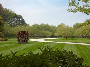 This undated photo provided by HOLLANDERdesign/Landscape Architects shows a sculpture by artist Robert Indiana and in a residential garden on the east end of Long Island in New York. The garden was designed by landscape architect Edmund Hollander. (HOLLANDERdesign/Landscape Architects via AP)
