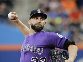 Colorado Rockies' Tyler Chatwood winds up during the first inning of the team's baseball game against the New York Mets on Saturday, July 15, 2017, in New York. Chatswood left the game during the first inning. (AP Photo/Frank Franklin II)