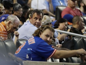 New Jersey Gov. Chris Christie watches during the fourth inning of a baseball game between the New York Mets and the St. Louis Cardinals on  Tuesday, July 18, 2017, in New York. (AP Photo/Frank Franklin II)