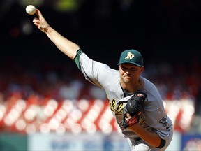 FILE - This Aug. 28, 2016 file photo shows Oakland Athletics relief pitcher Ryan Madson throwing during the ninth inning of a baseball game against the St. Louis Cardinals in St. Louis. The Washington Nationals acquired Madson and reliever Sean Doolittle from the Oakland Athletics for right-hander Blake Treinen and a pair of prospects, Sunday, July 16, 2017. (AP Photo/Billy Hurst, file)