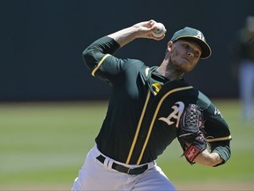 FILE - This July 19, 2017 file photo shows Oakland Athletics pitcher Sonny Gray working against the Tampa Bay Rays in the first inning of a baseball game in Oakland, Calif. Gray has been traded, Monday, July 31, 2017, to the Yankees from the Athletics for three prospects, boosting New York's starting rotation for an unexpected playoff run. (AP Photo/Ben Margot, file)