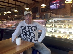 Michael Rubinsteyn, co-owner of the Efes Cafe and Bakery, poses for a photo on Friday, July, 7, 2017, inside his business located in the Brighton Beach neighborhood of the Brooklyn borough of New York. Rubinsteyn, 68, emigrated to the United States from Russia 40 years ago. New York City's Russian community has mixed emotions about the first meeting between President Donald Trump and Russian President Vladimir Putin. (AP Photo/Steve Peoples)