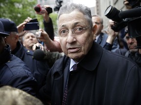 FILE - In this May 3, 2016 file photo, former New York Assembly Speaker Sheldon Silver is surrounded by media as he leaves the court in New York where he was sentenced to 12 years in prison on corruption charges. On Thursday, July 13, 2017, a federal appeals court overturned Silver's corruption conviction, saying the judge's instructions on law weren't consistent with a recent Supreme Court ruling. (AP Photo/Seth Wenig, File)