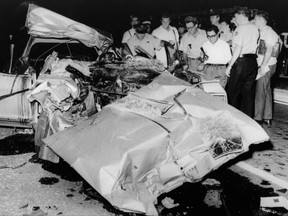 FILE - This June 29, 1967, file photo shows the mangled car that actress Jayne Mansfield died in after colliding with a truck, on Route 90 outside of New Orleans. Fifty years after Mansfield car slammed underneath a tractor-trailer, auto safety advocates say hundreds of similar deaths annually could be prevented by guard rails mounted beneath trucks. New York Sen. Charles Schumer has called on federal regulators to require truck underride guards after two cars skidded under a jackknifed milk tanker in northern New York earlier this month. (AP Photo/File)