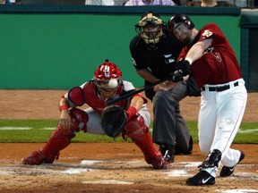 FILE- In this Oct. 17, 2004, file photo, Houston Astros' Jeff Bagwell hits a double off a pitch from St. Louis Cardinals Jason Marquis in the first inning in Game 4 of the National League Championship Series, in Houston. Bagwell, 48, who played his entire 15-year career with the Astros, will be inducted into he Baseball Hall of Fame in Cooperstown, N.Y. on Sunday, July 30, 2017 (AP Photo/Sue Ogrocki, File)