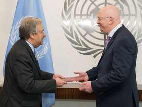 Russia's new ambassador to the United Nations Vassily Alekseevich Nebenzia, right, presents his credentials to U.N. Secretary General Antonio Guterres, at United Nations headquarters, Friday, July 28, 2017. (Eskinder Debebe/United Nations via AP)
