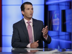 Donald Trump Jr. is interviewed by host Sean Hannity on his Fox News Channel television program, in New York Tuesday, July 11, 2017. Donald Trump Jr. has long been his father's id, the brawler who has helped fuel the president's pugilistic instincts and stood firm as one of his fiercest defenders. Now the president's eldest son is at the center of the firestorm over Russian connections swirling around his father's administration and trying to fight off charges that he was open to colluding with Moscow to defeat Hillary Clinton. (AP Photo/Richard Drew)