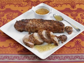 This May 24, 2017 photo shows crusty pork tenderloin, made with a barbecue rub of dark brown sugar, salt, pepper and paprika, at the Institute of Culinary Education in New York. This dish is from a recipe by Elizabeth Karmel. (AP Photo/Richard Drew)