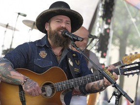 FILE - In a Tuesday, May 16, 2017 file photo, Zac Brown from the Zac Brown Band performs on NBC's Today show at Rockefeller Plaza, in New York. Brown on Sunday, July  16, 2017 visited 17-year-old Thomas Schoettle in a hospital, who missed the band's latest Philadelphia concert after he was paralyzed in a swimming pool accident. Schoettle hit his head and injured his neck after diving into a pool. He missed Brown's concert on Saturday, July 15,  so Brown flew to Bryn Mawr Rehab Hospital in Malvern and visited him Sunday. (Photo by Charles Sykes/Invision/AP, File)