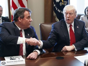 FILE - In a Wednesday, March 29, 2017 file photo, President Donald Trump shakes hands with New Jersey Gov. Chris Christie during an opioid and drug abuse listening session, in the Cabinet Room of the White House in Washington. Christie on Monday, July 17, 2017, addressed Donald Trump Jr.'s 2016 meeting with a Russian attorney, saying it's "probably against the law" to get opposition research for his father's presidential campaign from a foreign country. But Christie, a friend and adviser to President Trump, said that it's too early be "jumping to conclusions" and that there's no evidence the campaign obtained such research. (AP Photo/Evan Vucci, File)