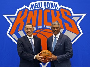 New York Knicks general manager Scott Perry, left, and president Steve Mills pose for a picture after a news conference in Greenburgh, N.Y., Monday, July 17, 2017. (AP Photo/Seth Wenig)