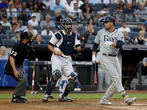 Tampa Bay Rays' Lucas Duda looks back at home plate umpire Tripp Gibson after striking out against the New York Yankees during the second inning of a baseball game, Friday, July 28, 2017, in New York. (AP Photo/Julie Jacobson)