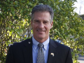 Scott Brown, the U.S. ambassador in New Zealand, poses for a photograph at the U.S. Embassy on Tuesday, July 11, 2017, in Wellington, New Zealand. Brown took up the post two weeks earlier, becoming one of the first ambassadors tapped by President Donald Trump to begin serving. (AP Photo/Nick Perry)