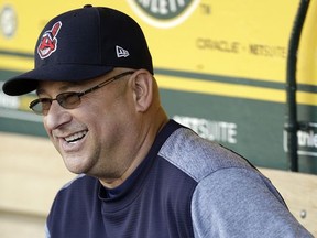 Cleveland Indians manager Terry Francona laughs in the dugout prior to the team's baseball game against the Oakland Athletics on Friday, July 14, 2017, in Oakland, Calif. Francona rejoined his team one week after undergoing a minor procedure for an irregular heartbeat. The 58-year-old Francona was supposed to manage the American League during Tuesday's All-Star Game but opted out after undergoing a cardiac ablation procedure at the Cleveland Clinic on July 6. (AP Photo/Ben Margot)