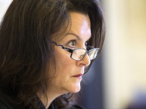 Hamilton County Common Pleas Judge Leslie Ghiz formally dismissed the voluntary manslaughter and murder charges against  former University of Cincinnati officer Ray Tensing Monday, July 24, 2017, in Cincinnati. Tensing was charged with murdering Sam DuBose during a routine traffic stop on July 19, 2015. Two juries couldn't reach unanimous agreement on the state charges, leading to mistrials. (Liz Dufour/The Cincinnati Enquirer via AP)
