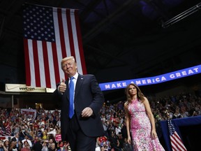President Donald Trump and first lady Melania Trump arrive for a rally, Tuesday, July 25, 2017, at the Covelli Centre in Youngstown, Ohio (AP Photo/Carolyn Kaster)