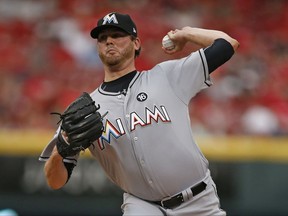 Miami Marlins starting pitcher Chris O'Grady throws to the Cincinnati Reds during the first inning of a baseball game, Saturday, July 22, 2017, in Cincinnati. (AP Photo/Gary Landers)