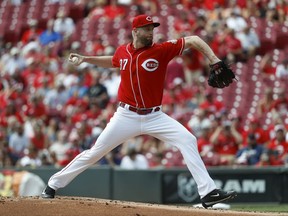 Cincinnati Reds starting pitcher Scott Feldman throws in the first inning of a baseball game against the Washington Nationals, Monday, July 17, 2017, in Cincinnati. (AP Photo/John Minchillo)