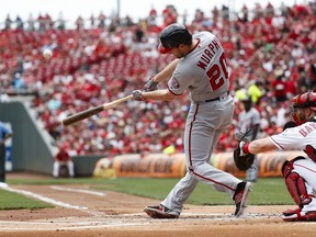 Washington Nationals' Daniel Murphy hits a two-run home run off Cincinnati Reds starting pitcher Homer Bailey in the first inning of a baseball game, Sunday, July 16, 2017, in Cincinnati. (AP Photo/John Minchillo)