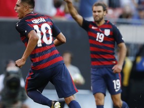 United States' Joe Corona (10) celebrates with Graham Zusi (19) after scoring a goal against Nicaragua during a CONCACAF Gold Cup soccer match in Cleveland, Ohio, Saturday, July 15, 2017. (AP Photo/Ron Schwane)