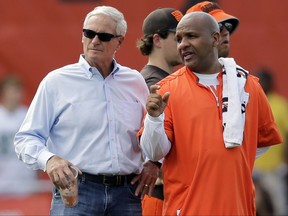 Cleveland Browns owner Jimmy Haslam, left, nS coach Hue Jackson talk during practice at the NFL football team's training camp facility, Thursday, July 27, 2017, in Berea, Ohio. (AP Photo/Tony Dejak)