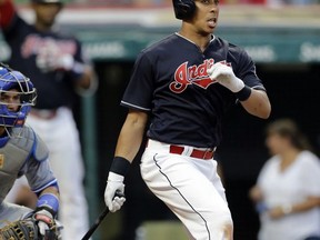Cleveland Indians' Michael Brantley hits a double off Toronto Blue Jays starting pitcher Marcus Stroman in the sixth inning of a baseball game, Saturday, July 22, 2017, in Cleveland. (AP Photo/Tony Dejak)